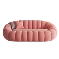 a pink couch with two pillows on it