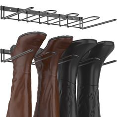 three pairs of boots hanging on a metal rack and two leather boot holders in front of them