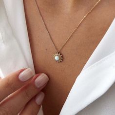 Illuminate your style with our Dainty Opal Sun Necklace. Crafted from 14k solid gold, this delicate piece features a radiant opal sun design, blending timeless elegance with a touch of celestial charm. Perfect for any occasion. This necklace is crafted with real 14k solid gold(not plated, not vermeil, not gold filled) You don't need to worry about water contact since real gold doesn't tarnish. The center is a man made opal bezel set delicately into the gold frame. This ensures that your piece ke Sun Necklace, Sun Design, About Water, August Birthstone Jewelry, July Birthstone Jewelry, Artisan Gift, Gold Colors, Zodiac Jewelry, Jewelry Ring Box