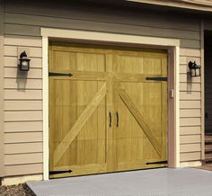 a wooden garage door with two lights on each side