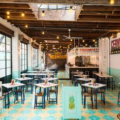 the inside of a restaurant with tables and chairs