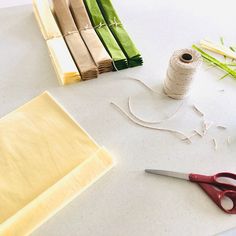 scissors, twine and other craft supplies on a table