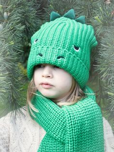 Dino style. The T-Rex Knitted Hat adds a bit of fun to your little one's winter beanie with a green dino face (complete with spikes!). Suitable for ages 3+.