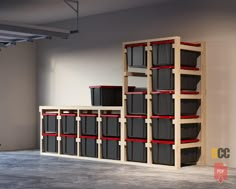 an empty room with several shelves and bins on the floor in front of it