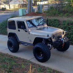 the jeep is parked on the side of the road