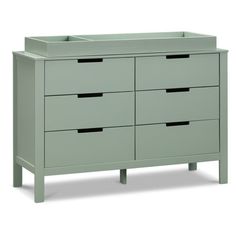 a green dresser with six drawers and two handles on each drawer, in front of a white background