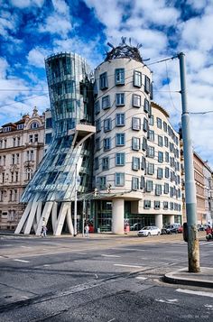 a tall building sitting on the side of a road