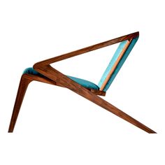 a wooden chair with a blue cushion on it's back legs and armrests