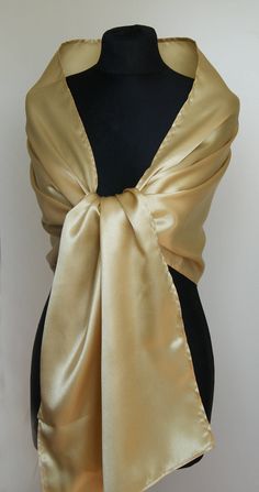 A very elegant satin shawl for your wedding party or evening dress. Made of luxury satin, slightly sparkles on the sun or light. Color: gold ( other colors are available ) Size : 170 cm x 45 cm You can use it as a wrap, shawl or stola. WE have matching satin bags in Etsy Shop! WE accept credit cards! Luxury Gold Shawl For Wedding, Gold Fitted Shawl For Party, Fitted Gold Shawl For Party, Classic Gold Silk Scarf, Elegant Gold Silk Scarf For Evening, Cream Shawl For Evening, Formal Gold Silk Scarf, Elegant Cream Shawl For Evening, Classic Gold Silk Scarf For Formal Occasions