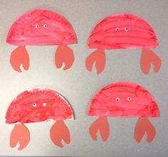 four paper plates with red hats on them and one is made to look like fish