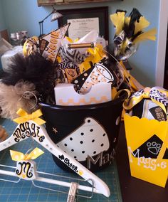 a basket filled with assorted items sitting on top of a table next to scissors