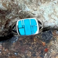 This beautiful Sterling Silver Ring, as part of the Arizona Blue Collection features Kingman Turquoise. Stone Setting: 1/2" x 5/8" The ring is designed by David Rosales, one of the finest contemporary Southwest Artists in the world. He is the founder and co-owner of Supersmiths, Inc. of Gallup, NM. Each ring is custom made and carries a lifetime guarantee. Modern Turquoise Sterling Silver Ring With Polished Finish, Modern Polished Turquoise Ring In Sterling Silver, Modern Sterling Silver Turquoise Ring With Polished Finish, Modern Turquoise Ring In Sterling Silver With Polished Finish, Modern Turquoise Gemstone Ring, Modern Turquoise Anniversary Ring, Modern Turquoise Ring With Polished Finish, Modern Turquoise Round Ring, Modern Blue Turquoise Gemstone Ring