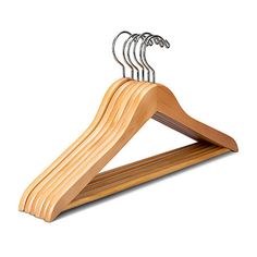 a wooden suit hanger with five pairs of clothes hanging from it's sides