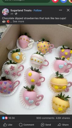 a box filled with chocolate covered strawberries and tea cups