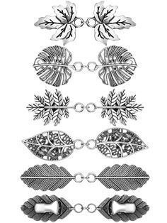 an assortment of metal objects with chains and leaves on the ends, all in black and white