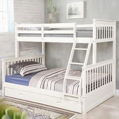 a white bunk bed sitting on top of a wooden floor