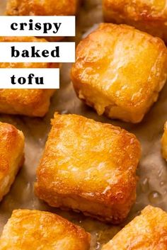 crispy baked tofu on a baking sheet with the words crispy baked tofu above it