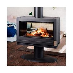 a fire burning inside of a stove in a living room