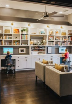 a living room filled with furniture and bookshelves