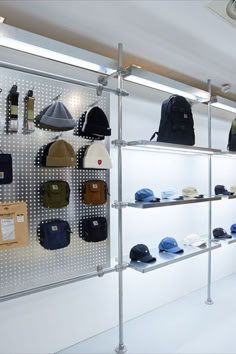 hats are hanging on the wall in a hat store, and there is no image here to provide a caption for