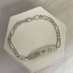 Personalized nameplate bracelet in sterling silver. We can engrave names, initials or any words that you would like on top of or even inside the bracelet. These bar bracelets are very cute and durable. The chain style is Figaro chain Surprise your loved ones with a great gift for his birthday, Christmas, Father's Day, or any other occasion. It takes 14 to 21 business days ♥ The most unique jewelry you can find, perfect gift for you and your loved one. ♥ All our jewelry is custom made by hand wit Luxury Initials Bracelet For Anniversary, Classic Personalized Initials Bracelet, Sterling Silver Initials Bracelet For Personalized Gift, Personalized Sterling Silver Initials Bracelet, Personalized Stainless Steel Nameplate Bracelet, Breslet For Man, Silver Adjustable Nameplate Jewelry, Adjustable Silver Nameplate Jewelry, Classic Sterling Silver Bracelet For Valentine's Day Gift