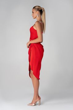 Our ‘Juliet’ midi dress is cut from the softest silk Satin for that perfect drape in a romantic Wine Red hue. It features a glamorous handmade rhinestone crystal Straps. ‘Juliet ' is super comfortable to wear and the bodice features our incredible corsetry boning for a super cinched fit to accentuate your waist and is beautifully draped at the low baring neckline, held by dainty rouleau shoulder straps.The skirt is slightly gathered to really flatter your figure and pleated to delicately drape a