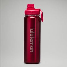 a red water bottle with the word ummelo printed on it and a pink lid