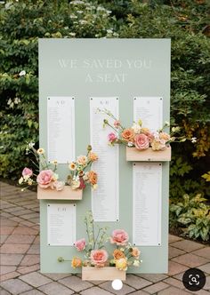 a sign with flowers on it that says, we saved you a seat at the ceremony