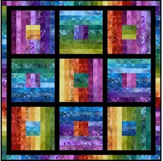 a colorful quilt with squares and stripes on it