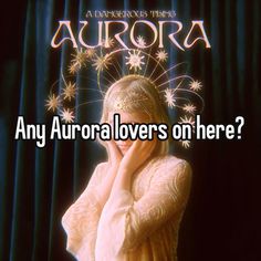 a woman with her hand on her face in front of a curtain and the words aurora