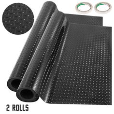 two rolls of black rubber flooring next to each other with 2 rings on top