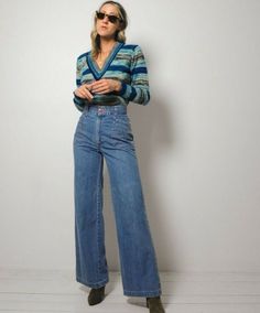 Amazing vintage 70s flared jeans. Lighter weight, soft denim. Ultra high waist with zipper and button closure. Stitched pockets on front and back. Flared bellbottom shape. Please see measurements. Original seller's try on photo included. Asking what I paid. Waist : 12.5" Length : 43.5" Inseam : 32" Rise : 12" Hips : 18" Fabric : cotton In excellent condition - no flaws to note. Model is 5'7" / bust: 34" / waist: 25" / hips: 37" 70s Inspired Wide Leg Flare Jeans For Fall, 70s Inspired Flare Jeans For Fall, 70s Inspired Fall Flare Jeans, 70s Inspired Wide Leg Jeans For Spring, 70s Inspired High Rise Fitted Jeans, Retro High Waist Flare Jeans For Fall, Retro High Waist Flare Jeans For Spring, 70s Inspired High Rise Jeans For Spring, 70s Inspired Denim Bottoms