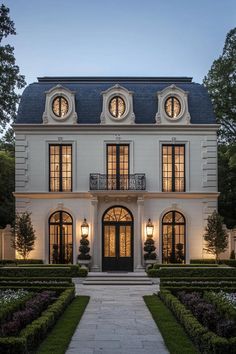 Sophisticated stone mansion with large windows and garden path. Check out the whimsical wonders of big houses where vastness meets imagination, transforming envy into inspiration! French Chateau Style, Chateau Style, Suburban House, French Architecture, Huge Windows, Modern Mansion, Wrap Around Porch