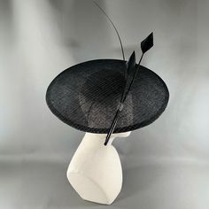 A seductive Dior style saucer in black sinamay strawcloth, with silver lurex thread. Simply and strikingly trimmed with two arrow feathers and one ostrich quill in black. Elastic and comb attachment for easy, comfortable wear. Lifted Millinery headwear is constructed with time honored techniques and fine craftsmanship. All hats are meticulously blocked and sewn by hand without the use of adhesives to attach trims. This ensures a long lasting hat with the ability to be retrimmed throughout the ye Nature, Chic Outfits, Saucer Hat, Feather Arrow, Dior Style, Arrow Feather, Hat Box, Chic Clothes, Easy Workouts