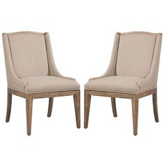 a pair of beige chairs sitting next to each other