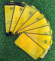 five yellow cards with numbers on them sitting in the grass