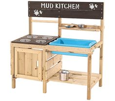 a wooden play kitchen with a sink and potting pan on the stove top,