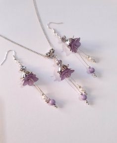 Purple Turquoise Victorian Silver flower jewelry set lavender flower set necklace earrings Purple flower jewelry set Boho Silver set gift Gorgeous  Victorian style jewelry set necklace and earrings . Bohemian necklace and earrings . Beautiful Set of silver-tone Antique style lavender purple plastic flowers with little purple Turquoise necklace and earrings. Silver-tone Victorian style necklace and earrings. Boho necklace. Bohemian necklace and earrings. Romantic necklace and earrings. Royal style jewelry set. Baroque style jewelry set. Antique style jewelry set. Gothic style jewelry set.  Perfect Gift for girlfriend,  mother,  sister,  bridesmaids or Maid of honor. Gift for special people or jewelry set for your special occasion. FREE SHIPPING  Material: purple turquoise , silver toned met Purple Sterling Silver Flower-shaped Jewelry, Jewelry For Purple Dress, Purple Flower-shaped Sterling Silver Jewelry, Adjustable Purple Flower Earrings As Gift, Adjustable Purple Flower Earrings For Gift, Elegant Purple Flower Necklace For Gift, Delicate Flower Charm Dangle Jewelry, Delicate Dangle Flower Charm Jewelry, Delicate Dangle Jewelry With Flower Charm