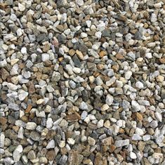 the rocks are all different colors and sizes in this photo, but they look like gravel