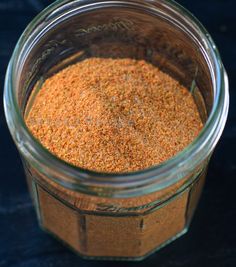 a jar filled with spices sitting on top of a table