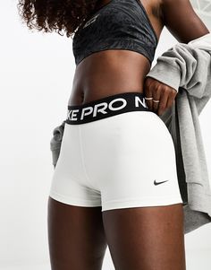 Shorts by Nike Training Take the short cut Branded design High rise Elasticized waistband bodycon fit White Nike Pros Outfit, Volleyball Shorts Outfit, Nike Pro Shorts Outfit, Short Nike Pro, Womens Workout Shorts, Nike Pro Collection, Track Fits, White Nike Pros, White Running Shorts