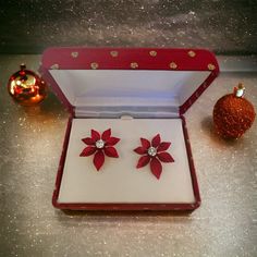 Beautiful New In Box 1990s Red Poinsettia Christmas Earrings With A Prong Set Rhinestone In The Center. They Come In A Red Box With Gold Glitter Polkadots. Perfect For A Gift. Link Is In Bio To All Our Stores On Linktree! Depop - Myezvintage Poshmark - Myezvintage And Myezwares (Vintage Home Decor) Reasonable Offers Welcomed! Bundle & Save! Buying This Fabulous Piece Can Bring Confidence & Lust Because You Will Be Continuing The Storyyou Are Consciously Choosing Something Good For The . We Make Horse Bow, Poinsettia Earrings, Silver Circle Earrings, Red Poinsettia, White Doves, Wire Weaving, Beaded Dangle Earrings, Christmas Earrings, Flower Earrings Studs