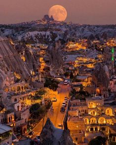 the full moon is setting over cappads in cappad village, cappad national park