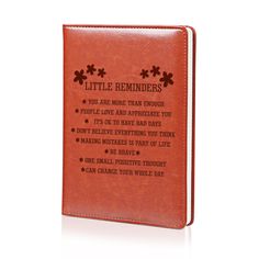 a red leather book with the words little reminders on it