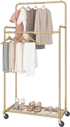 a gold garment rack with clothes and shoes on it