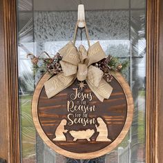 a christmas door hanger with the words jesus and reason for season written on it