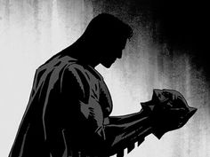 a black and white image of a man holding a bat in his hand with the shadow of batman on it