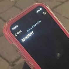 a close up of a cell phone on a person's hand with the screen lit up