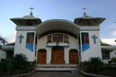 a church with two crosses on the roof