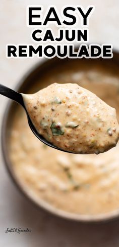 a spoon full of easy cajun remoulade with the title above it